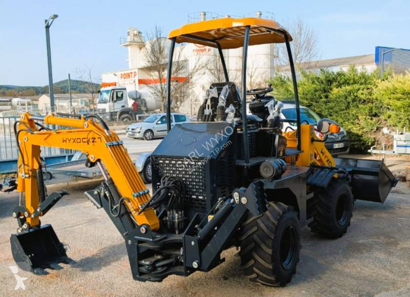 Traktor med grab Nuoman-Wyxo
