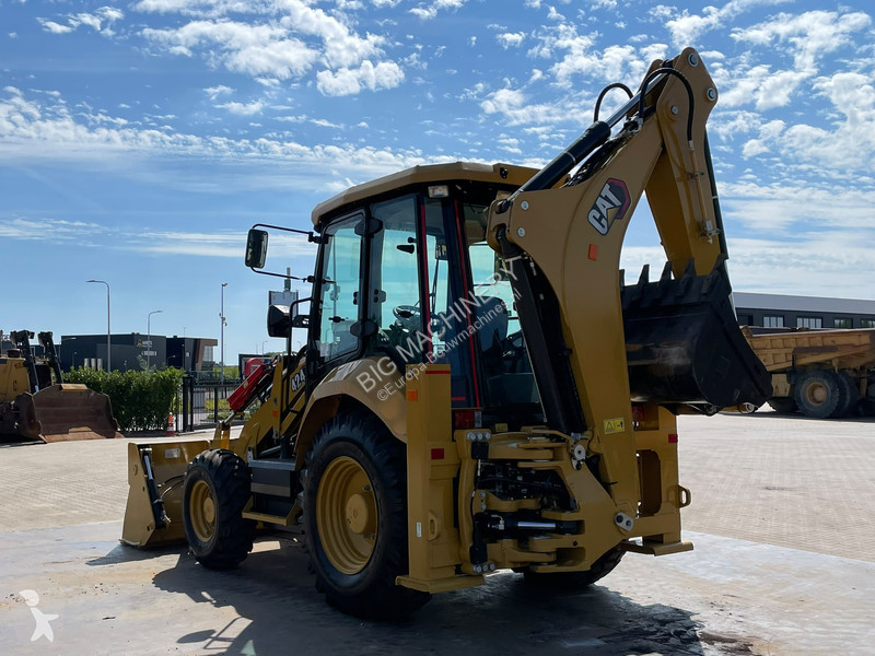Traktor med grab Caterpillar 424