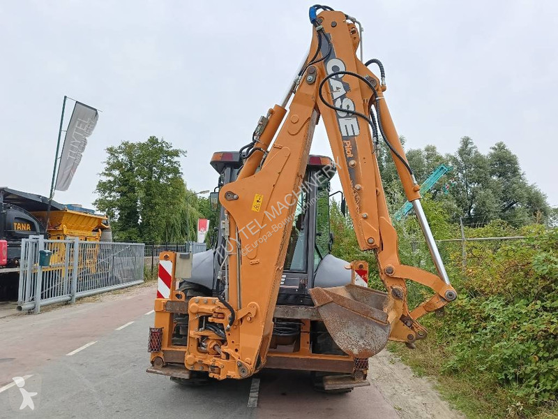 Traktor med grab Case backhoe loader graaf laad...