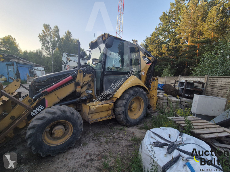 Екскаватор навантажувач Caterpillar