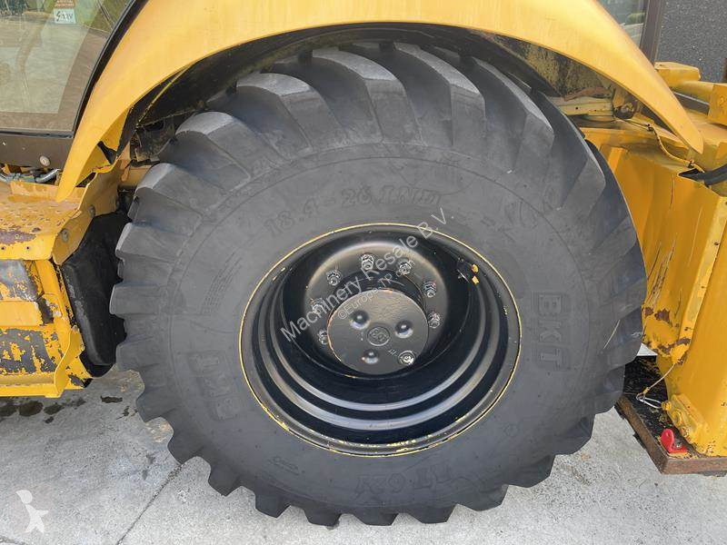 Traktor med grab Caterpillar