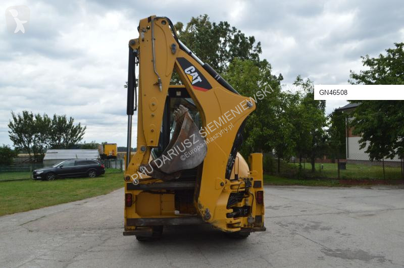 Traktor med grab Caterpillar