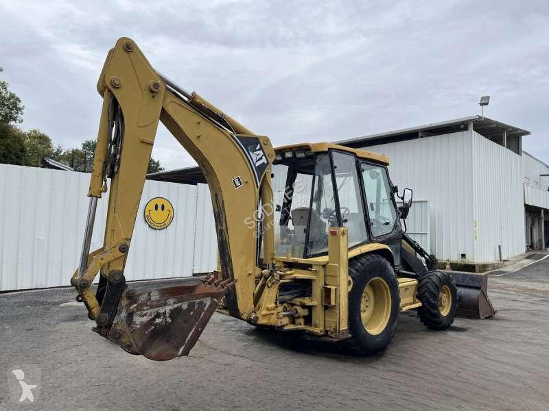 Traktor med grab Caterpillar