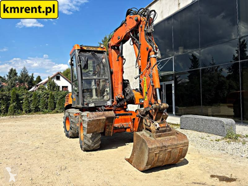 Traktor med grab Mecalac 12 MTX...