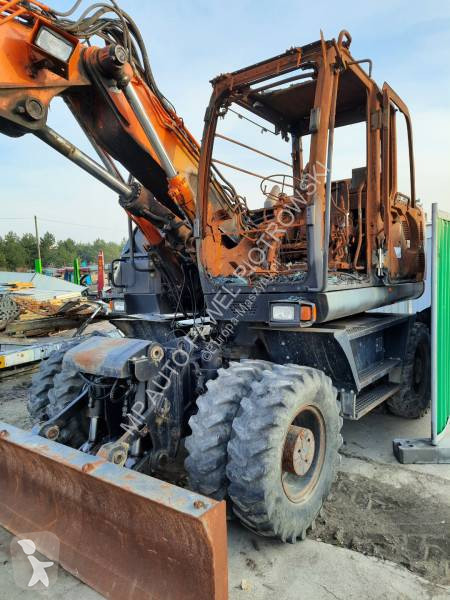 Traktor med grab Hitachi ZX210W-3