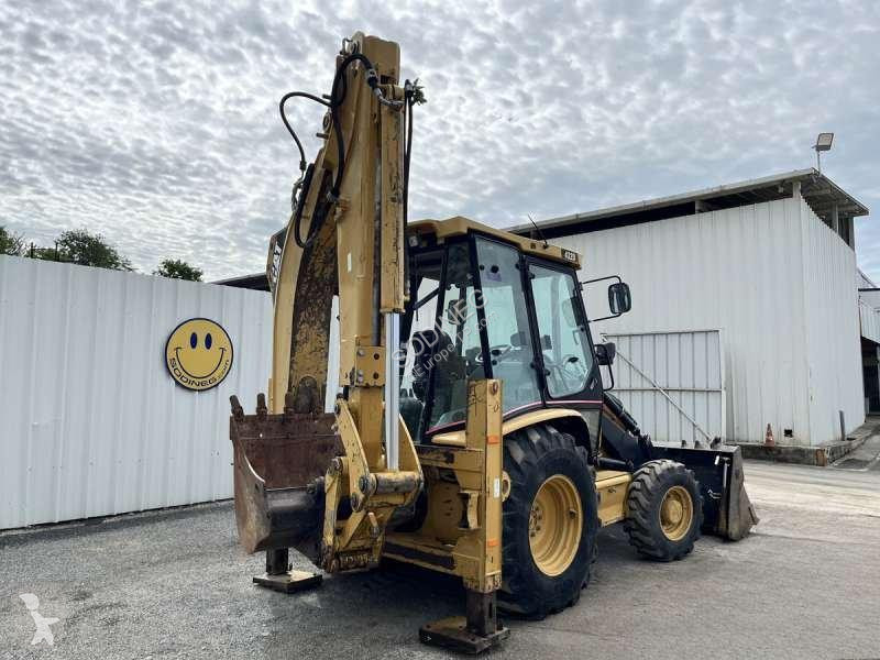 Traktor med grab Caterpillar