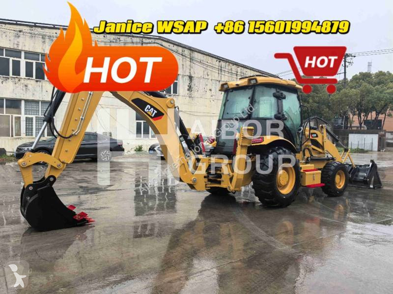 Traktor med grab Caterpillar