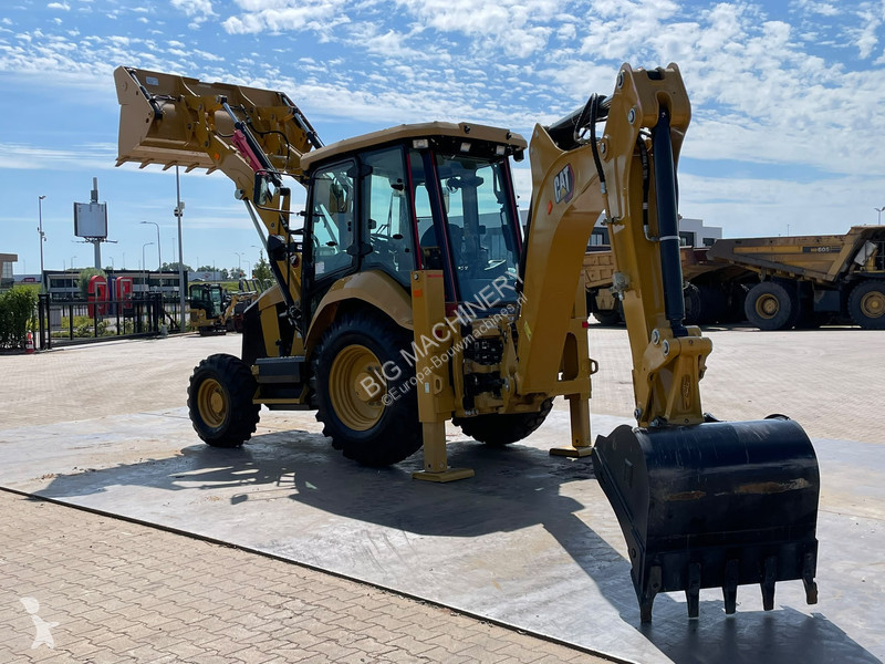 Traktor med grab Caterpillar 424