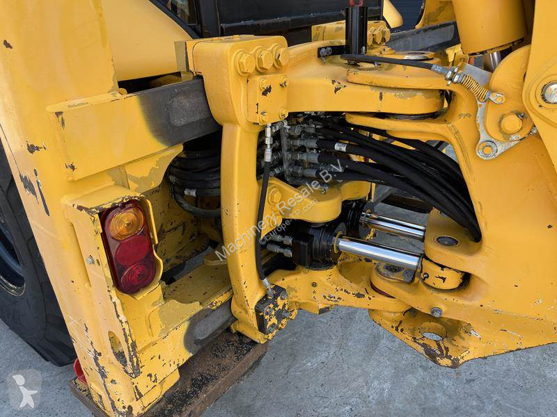 Traktor med grab Caterpillar