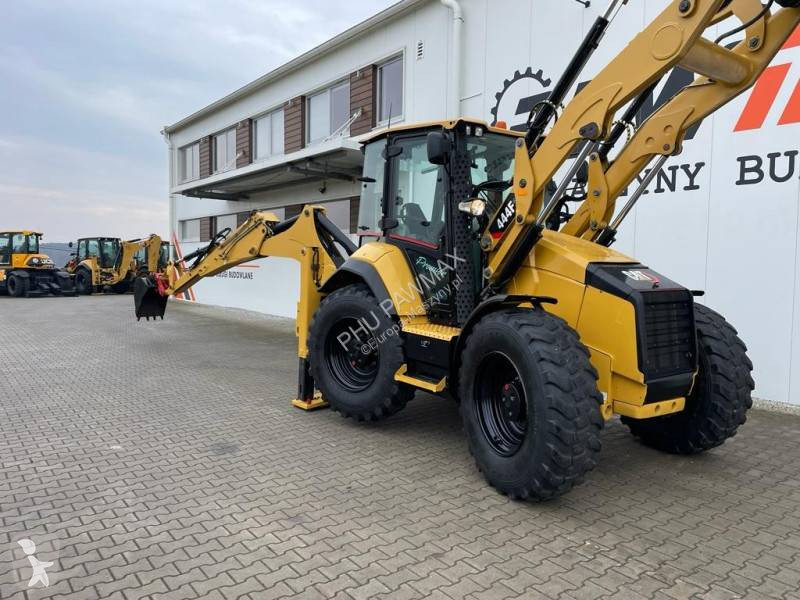 Traktor med grab Caterpillar 444 F2
