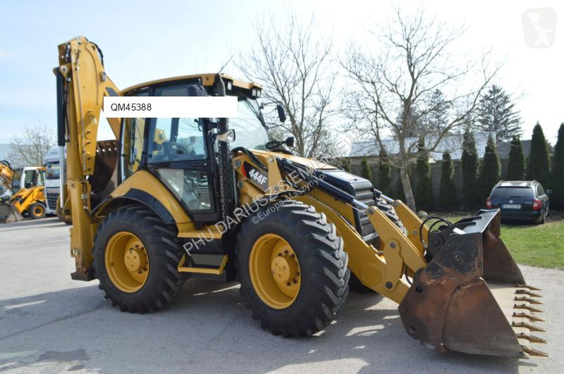 Traktor med grab Caterpillar 444F