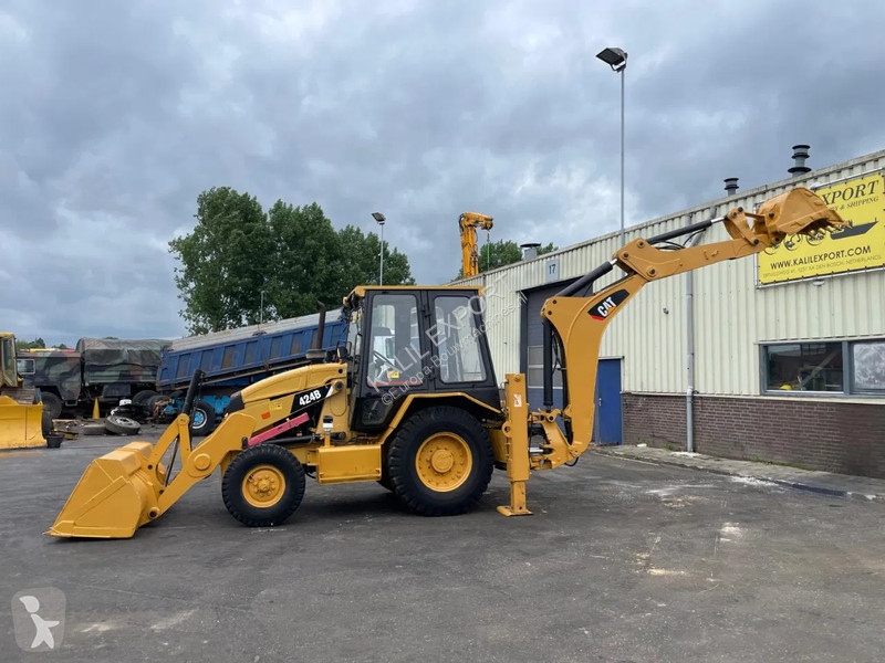 Traktor med grab Caterpillar 424B Backhoe...