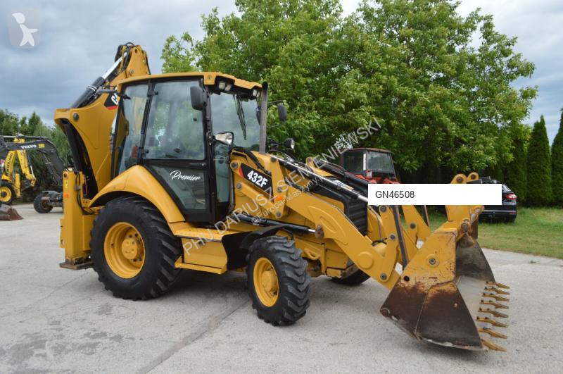 Traktor med grab Caterpillar
