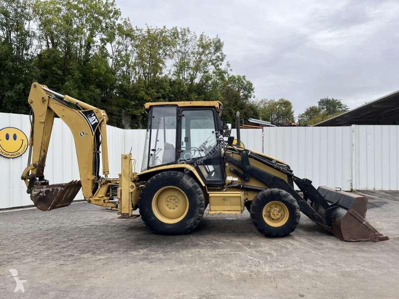 Traktor med grab Caterpillar