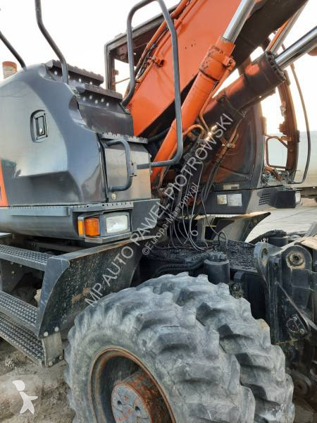 Traktor med grab Hitachi ZX210W-3