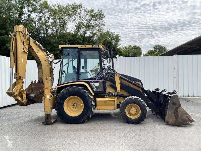 Traktor med grab Caterpillar
