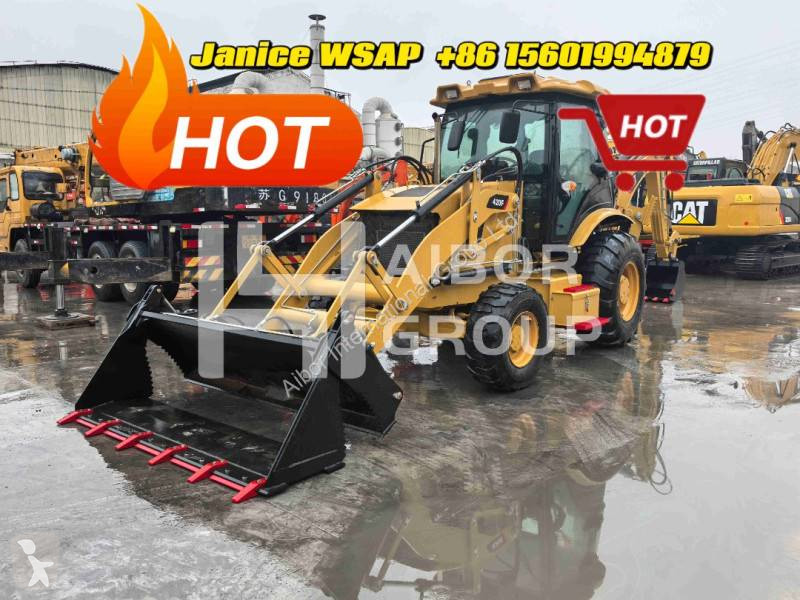 Traktor med grab Caterpillar