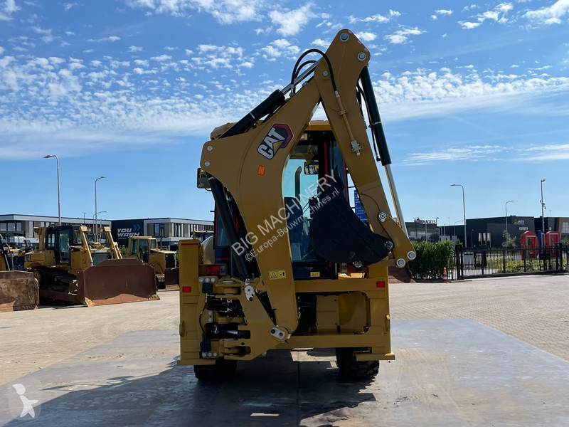 Traktor med grab Caterpillar 424