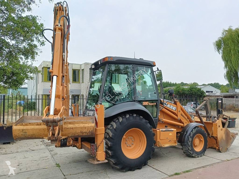 Traktor med grab Case backhoe loader graaf laad...