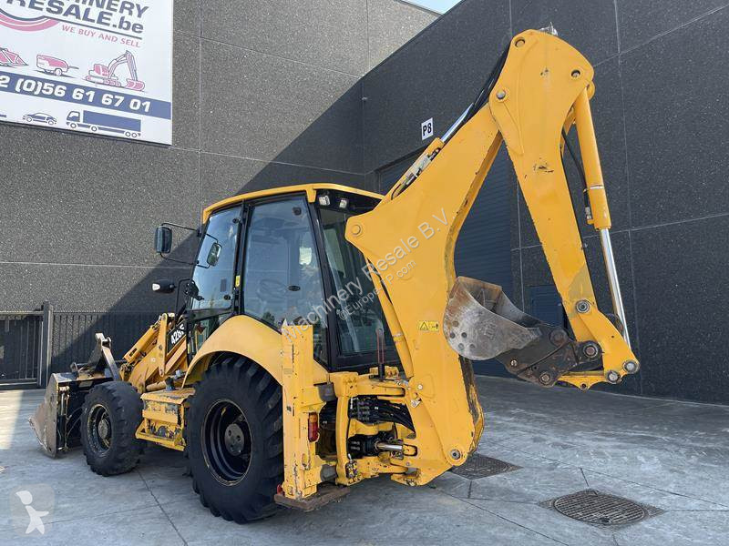 Traktor med grab Caterpillar