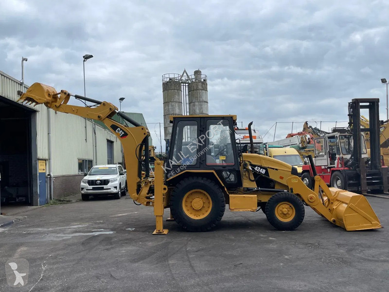 Traktor med grab Caterpillar 424B Backhoe...