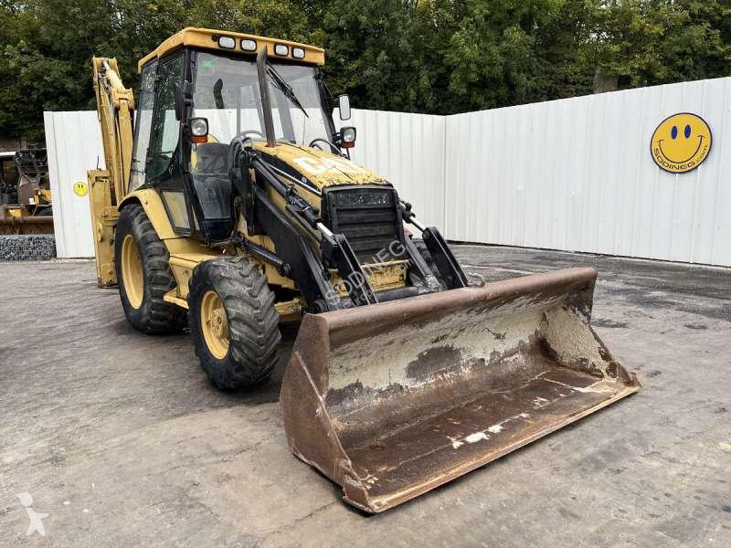 Traktor med grab Caterpillar