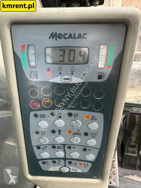 Traktor med grab Mecalac 12 MTX...