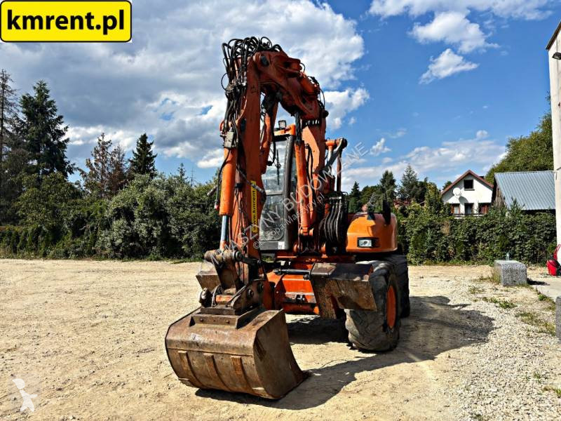 Traktor med grab Mecalac 12 MTX...