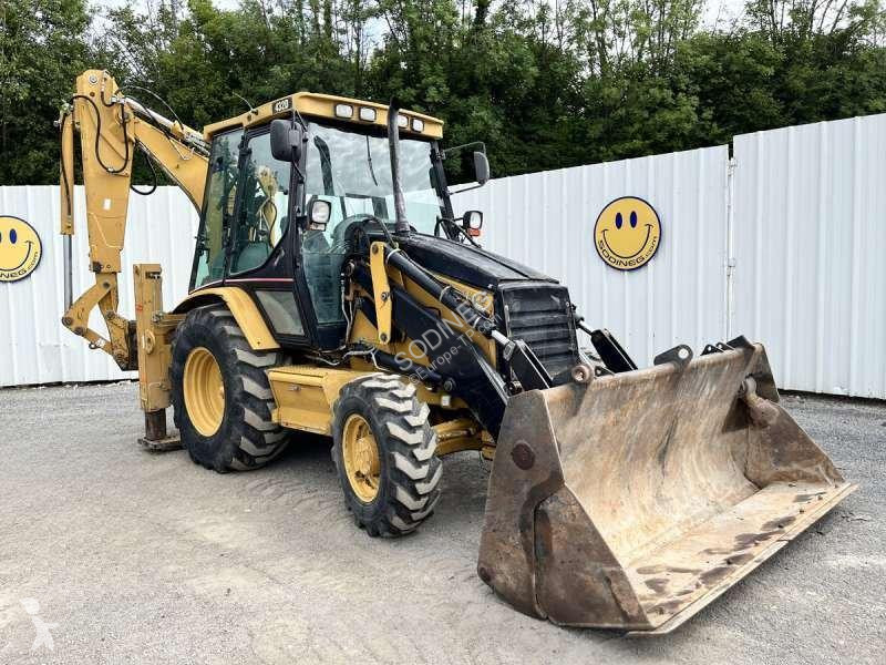 Traktor med grab Caterpillar