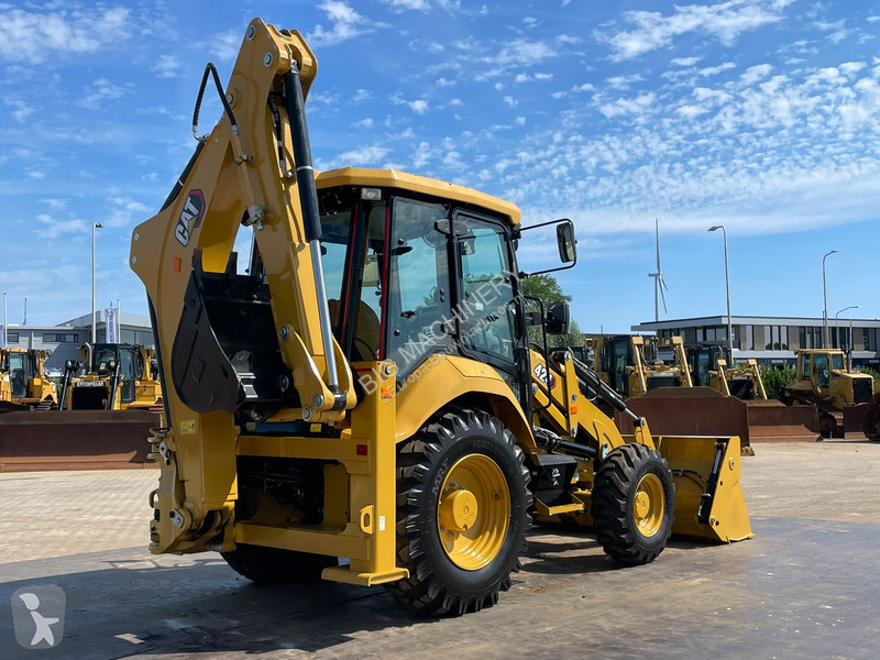 Traktor med grab Caterpillar 424