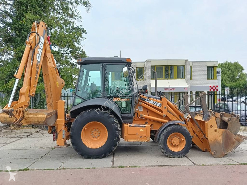 Traktor med grab Case backhoe loader graaf laad...