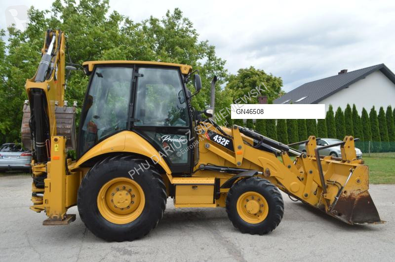 Traktor med grab Caterpillar
