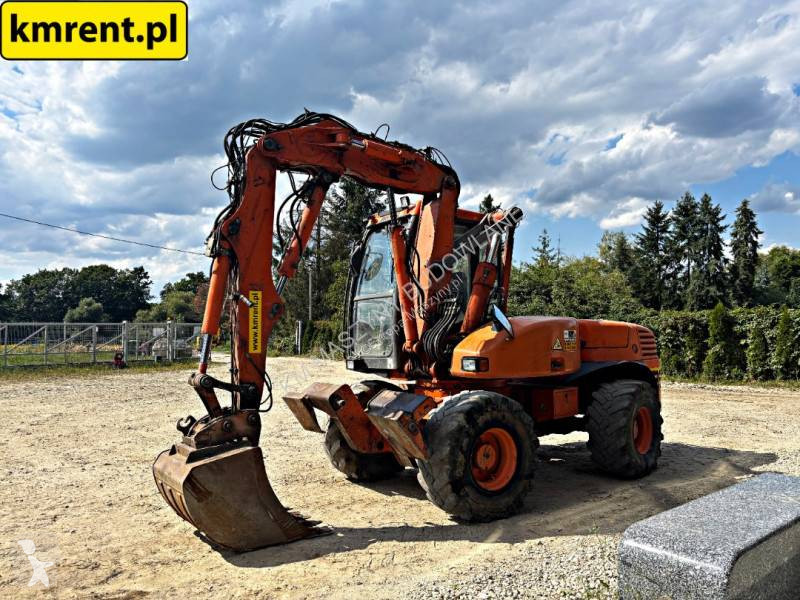 Traktor med grab Mecalac 12 MTX...