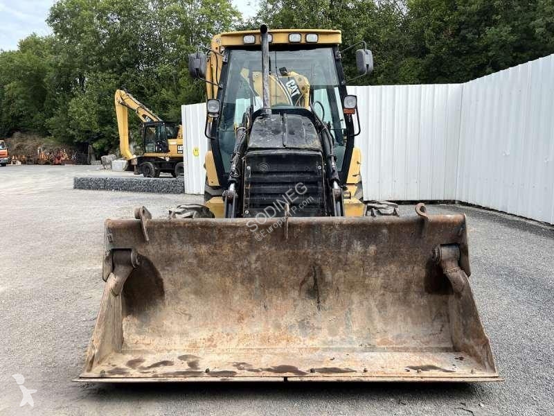 Traktor med grab Caterpillar