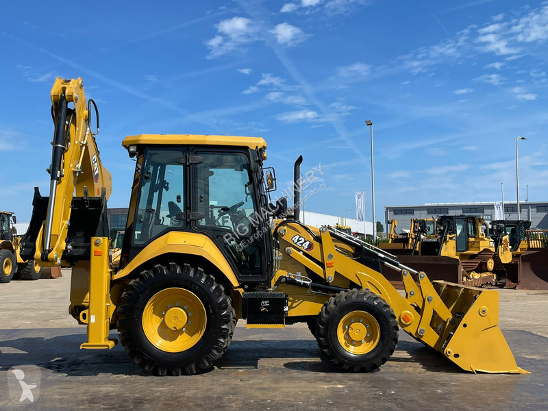 Traktor med grab Caterpillar 424