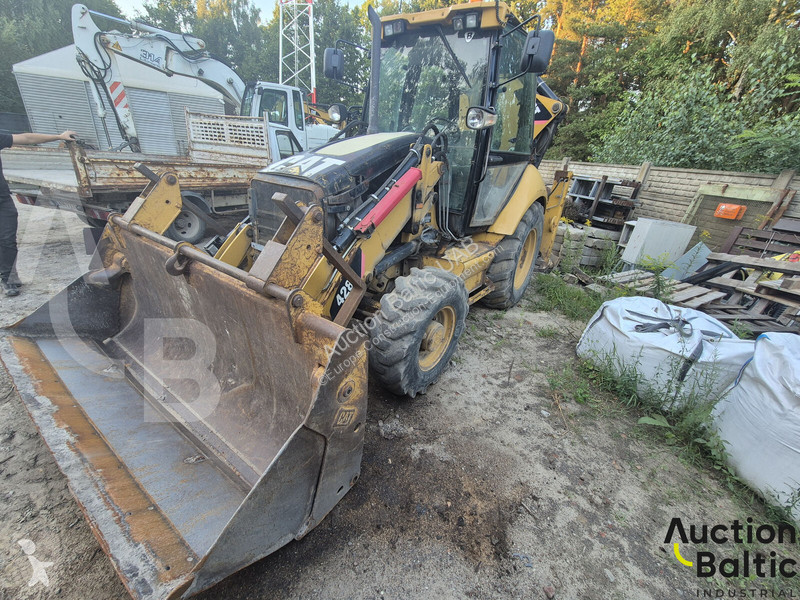 Екскаватор навантажувач Caterpillar