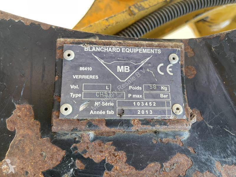 Traktor med grab Caterpillar