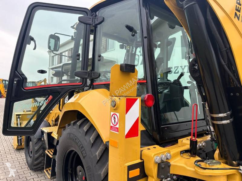 لودر حفار Caterpillar 2