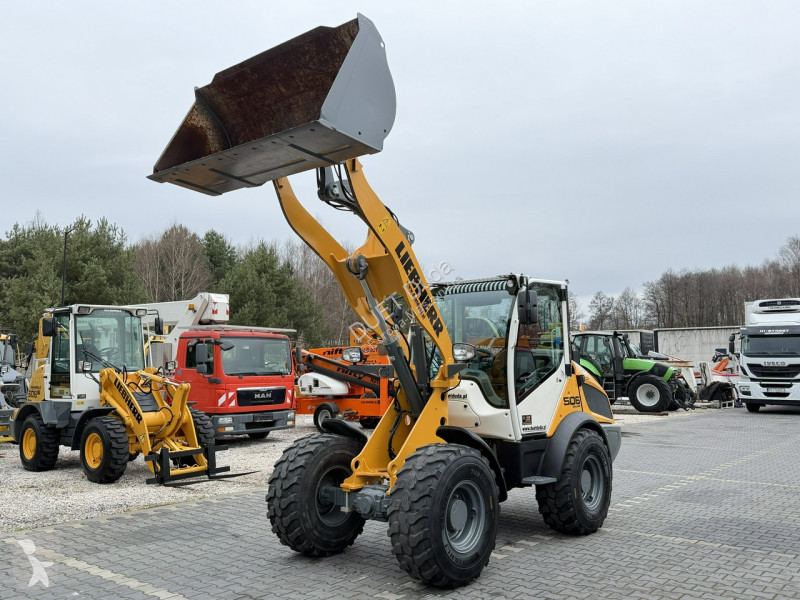 Nakladač Liebherr Compact Łyżka + Widły Super...