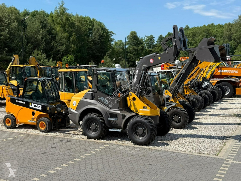 Læssemaskine New Holland C Compact Widły +...