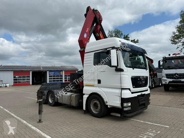 Cabeza tractora MAN TGX 6x2 mit HMF 3000-5 Kran...