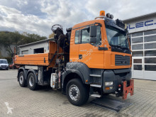 MAN TGA 28.350 6x4-4 Meiller Kipper + Kran +Winterd. truck used three-way side tipper