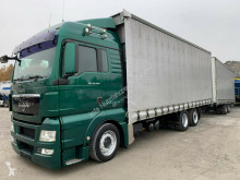 Kamion s návěsem posuvné závěsy MAN TGX TGX 26.440