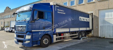 Camion MAN TGX 26.440 Teloni scorrevoli (centinato) usato