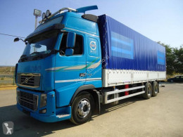 Caminhões caixa aberta com lona Volvo