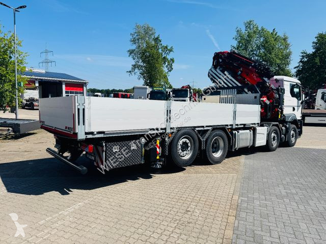 Ledat fordon MAN MAN 32.510 mit F710 Frontkran...