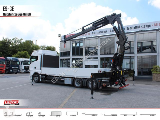 Camión MAN TGX 6x2-4 LL CH mit MKG HLK531 a5