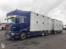 Kamion s návěsem Scania R 580 přívěs pro přepravu dobytka použitý