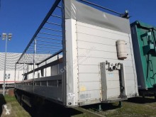 Trailer Schmitz Cargobull PLATEAU RIDELLES tweedehands platte bak boorden