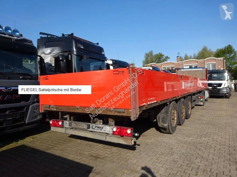 نصف مقطورة Fliegl Sattelpritsche mit Bordwänden...
